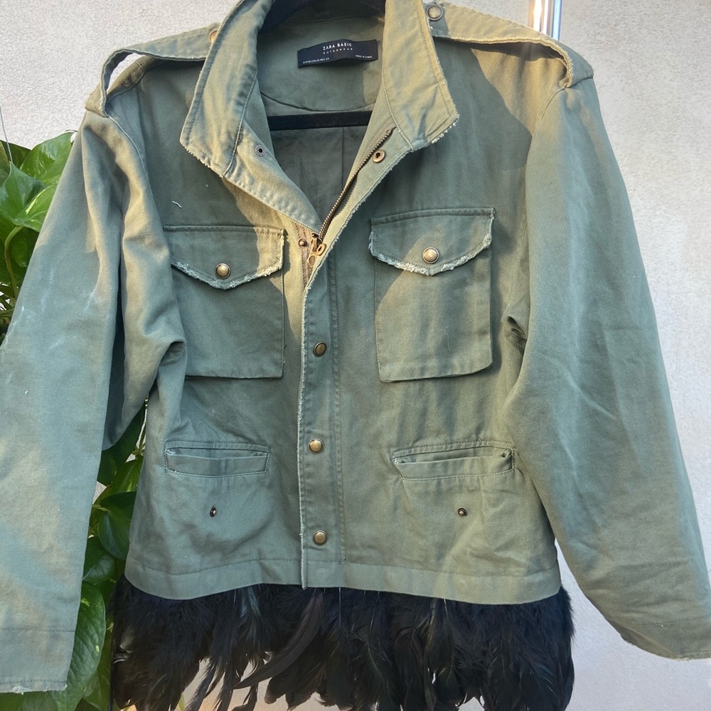 Green military jacket with feather detail